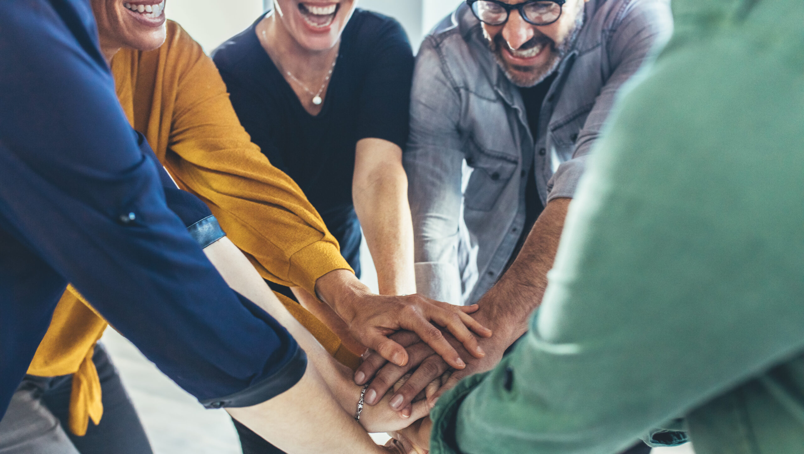 Business team making a stack of hands